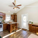 Image shows upgrade to have ceilings painted white. Model comes standard with white baseboards and white crown molding.