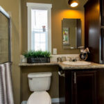 Image shows standard bathroom sink and standard elongated commode.