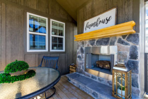 Image of upgrade to exterior wood burning fireplace. Model comes standard with white dual pane low-e windows.
