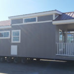 Model comes standard with 1 clerestory window as seen in the image. Model shown has been upgraded to include painted board and batt cempanel siding.