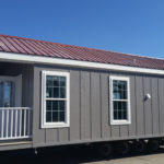 Park Models come standard with white dual pane low-e windows installed. Image shows upgrade to color metal roof. Galvalume metal roof standard on this model.