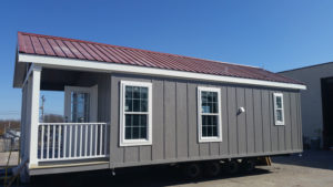Park Models come standard with white dual pane low-e windows installed. Image shows upgrade to color metal roof. Galvalume metal roof standard on this model.