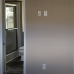 Picture shows optional pocket door installed b-w bedroom and bathrom for convenience.
