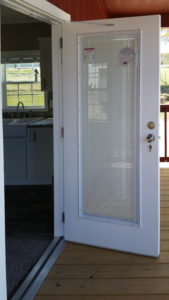 Image of upgrade to 36x80 white steel door with blinds built in. White 36x80 steel 9-lite is standard front door for this model.